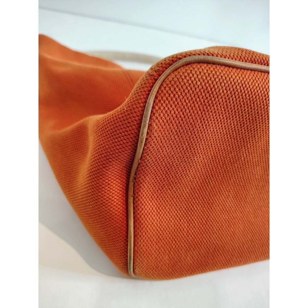 Michael Kors Marina hobo bag features an orange canvas body with braided rope... - Picture 6 of 11